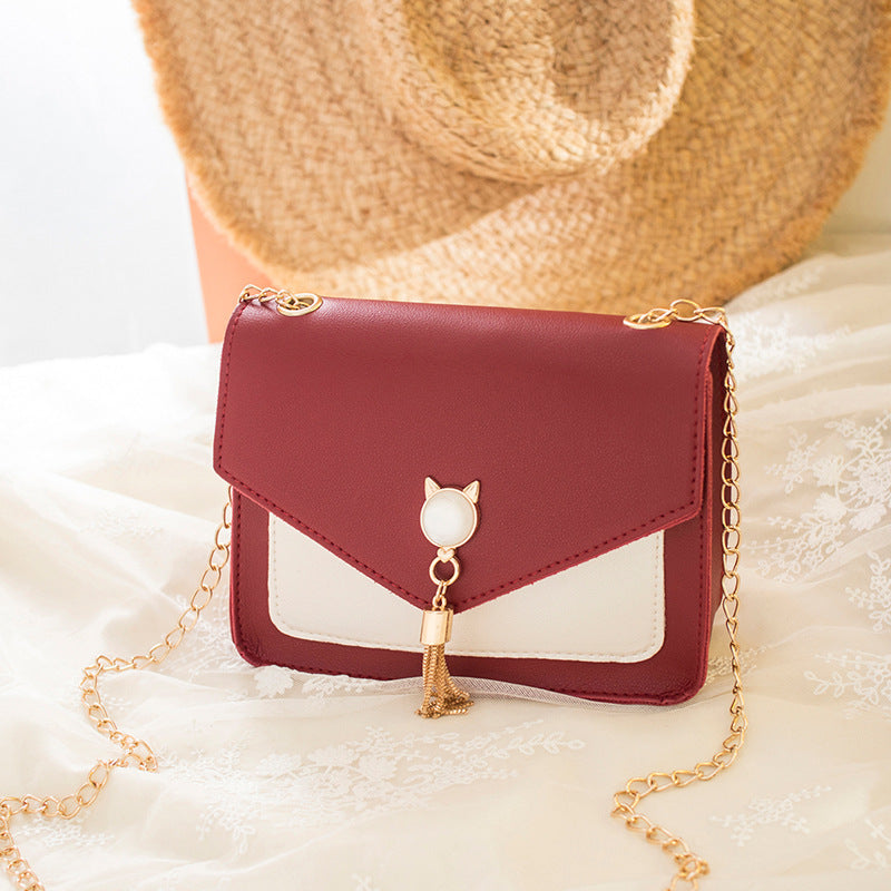 Small square crossbody bag with cat clasp