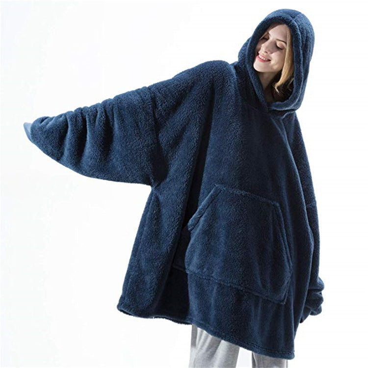 Person wearing oversized plush blanket hoodie