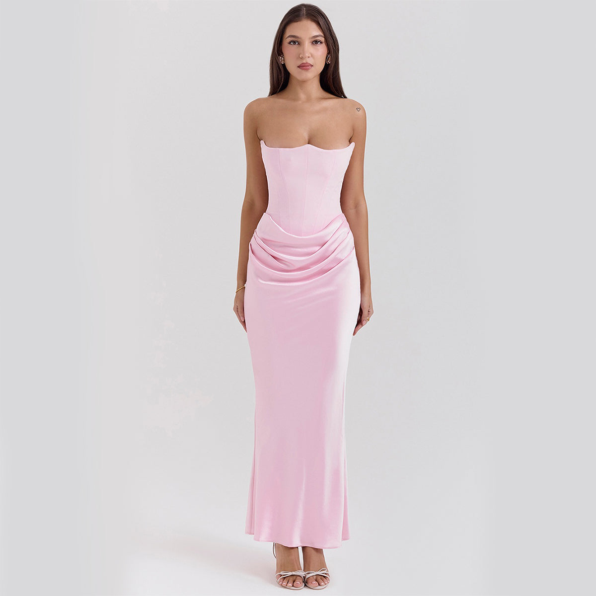Woman in a strapless satin maxi gown