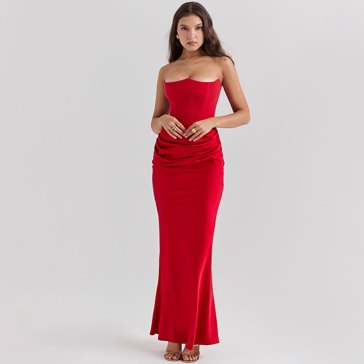 Woman in a strapless satin maxi gown