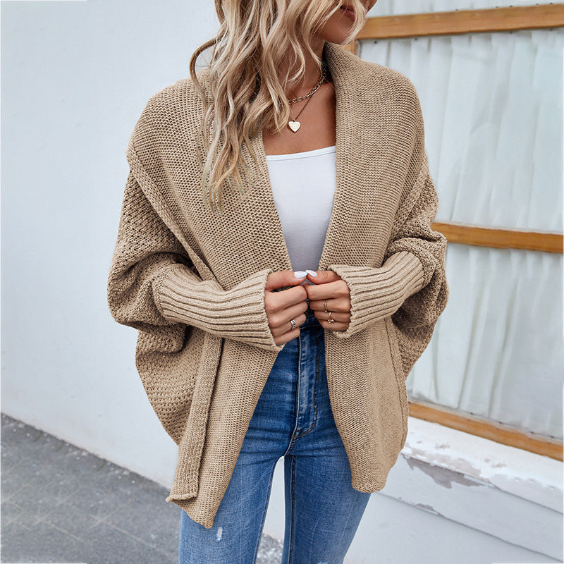 Woman in oversized batwing knit cardigan