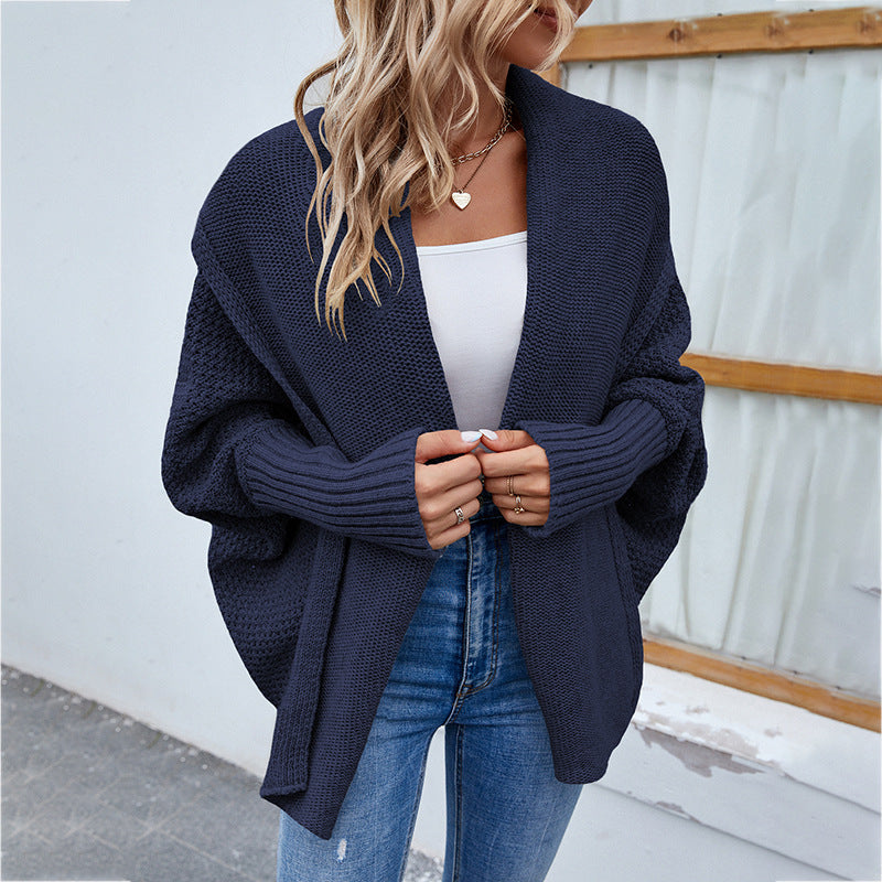Woman in oversized batwing knit cardigan