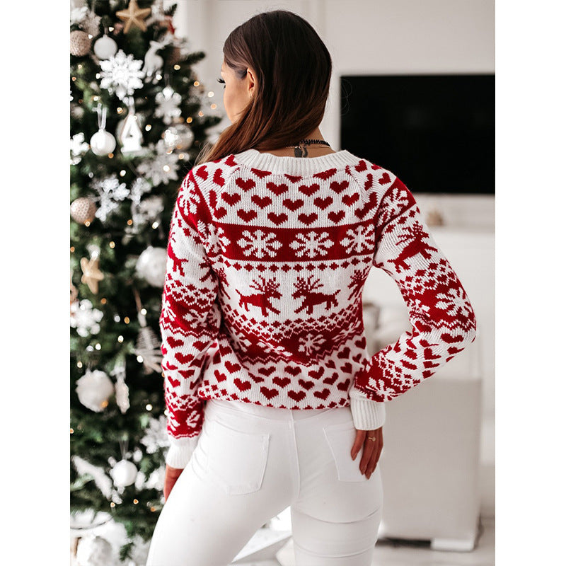 Woman in a reindeer jacquard sweater