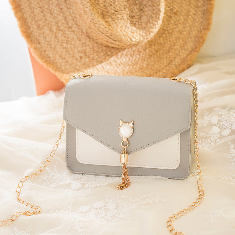 Small square crossbody bag with cat clasp
