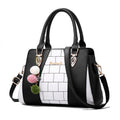 Two-tone handbag with pompom charm